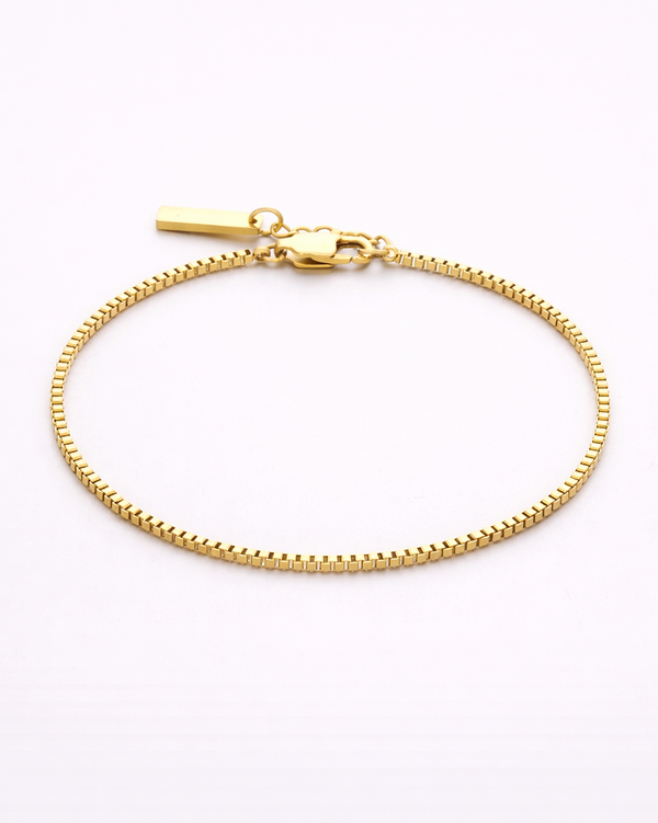Gold bracelet on a white background
